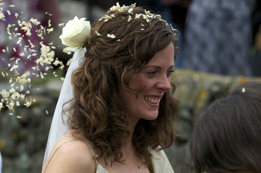 bride with a white rose in her hair