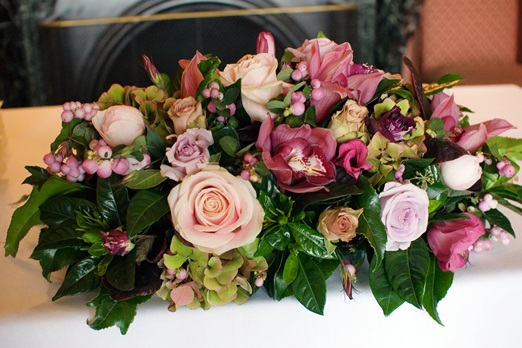 Blossom top table wedding flower arrangement