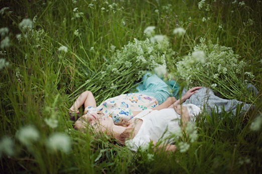 Lying in a field of cow parsley