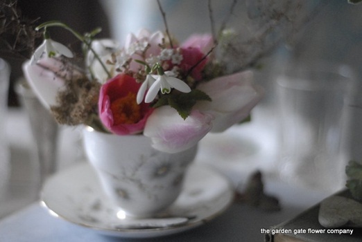 Vintage teacups of nostalgic spring flowers