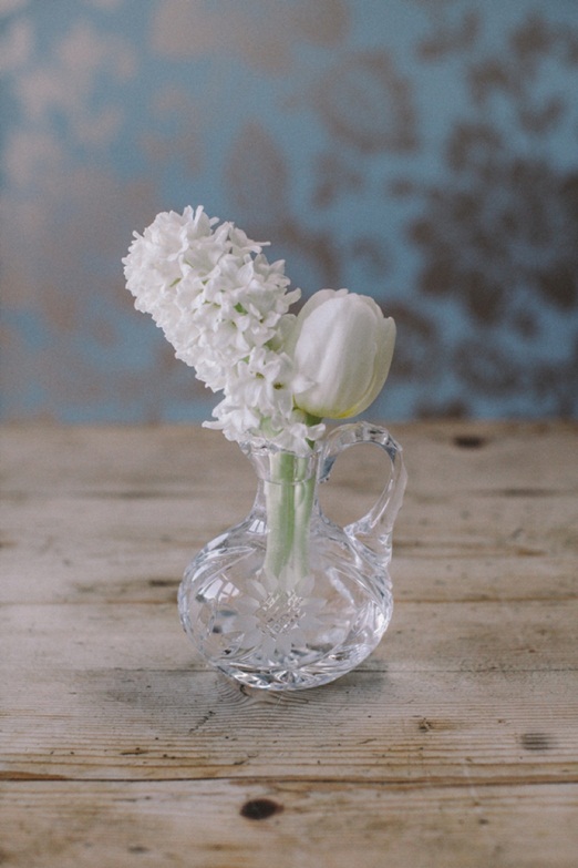 Spring arrangement of white tulips and hyacinths