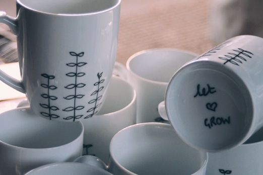 Hand illustrated 'let love grow' wedding mug favours