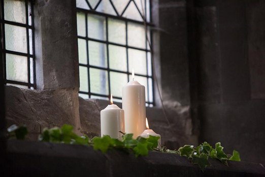 White church wedding candles and ivy