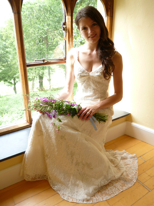 Bride with bouquet of foxgloves