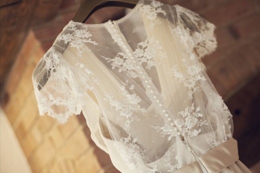 Lace backed wedding dress – photography http://www.milestones-photography.co.uk/ 