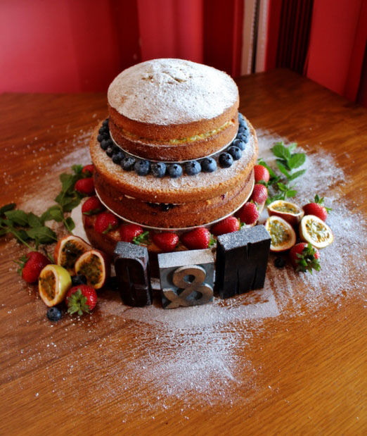 Tiered Victoria sponge wedding cake with fresh fruit