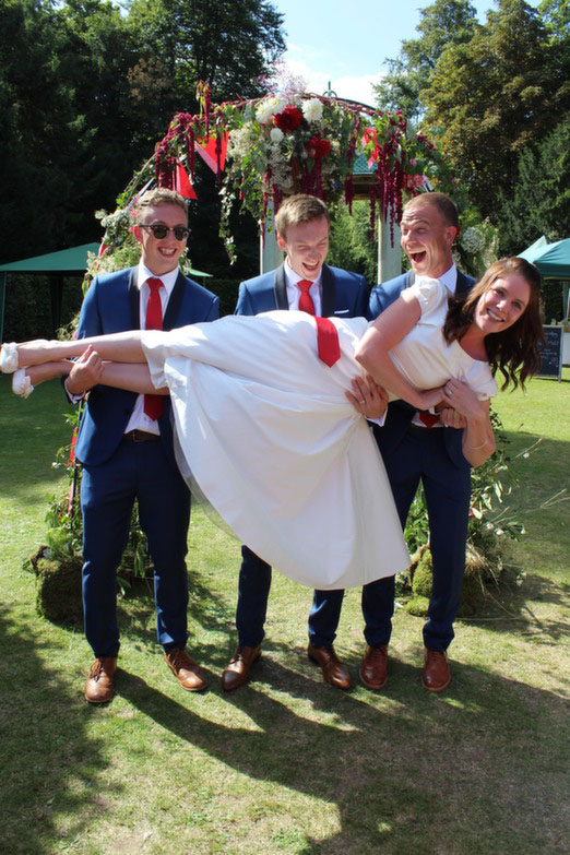 Ciara and Matt's relaxed outdoor wedding with vibrant red accents, handpicked florals and an amazing eclectic reception