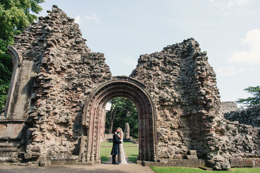 Bride and groom portrait amongst old abbey ruins - photography http://photosbyzoe.co.uk/