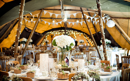 White wedding themed decorated tipi with hydrangea table centres // photography www.andyhook.com/ 
