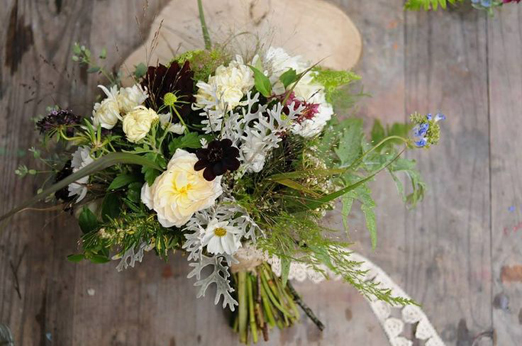 Autumn bridal bouquet of Chocolate cosmos, grasses and dusty miller by The Garden Gate Flower Company // The Natural Wedding Company