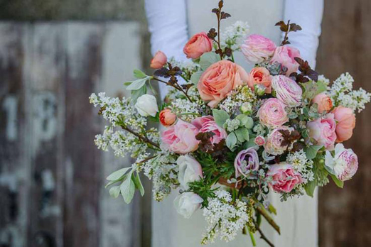 Romantic spring bridal bouquet with blossom, ranunculus and anemones // Green and Gorgeous Flowers // Clare West Photography