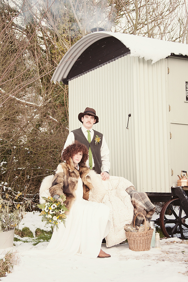 A snowy bleak mid-winter wedding inspired shoot with shepherds hut and a seasonal hedgerow bouquet // Photography Jennie Hill Photography // The Natural Wedding Company