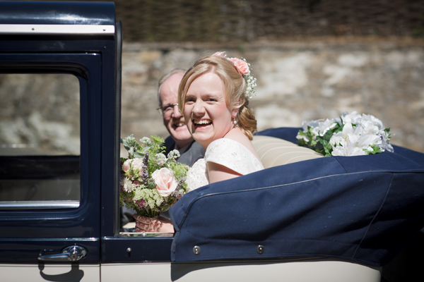 Country wedding bride in vintage car // Photography Belinda McCarthy // The Natural Wedding Company