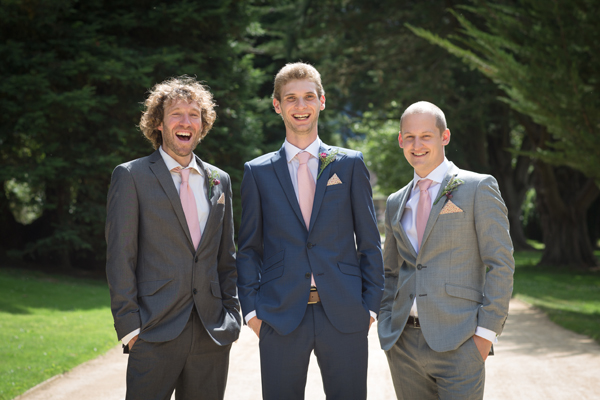 Groom and groomsmen with pink ties and pocket squares // Photography Belinda McCarthy // The Natural Wedding Company