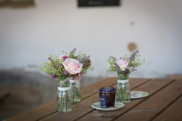 Jam jars of country flowers and herbs // Photography Belinda McCarthy // The Natural Wedding Company