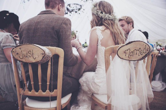 Log cut 'just married' chair signs // Photography Aime Herriott / The Natural Wedding Company