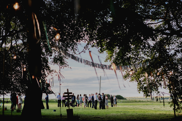 Zoe and Alex's rustic hippy outdoor wedding with a barefoot bride in a boho wedding dress // Photography Mariell Amelie // The Natural Wedding Company
