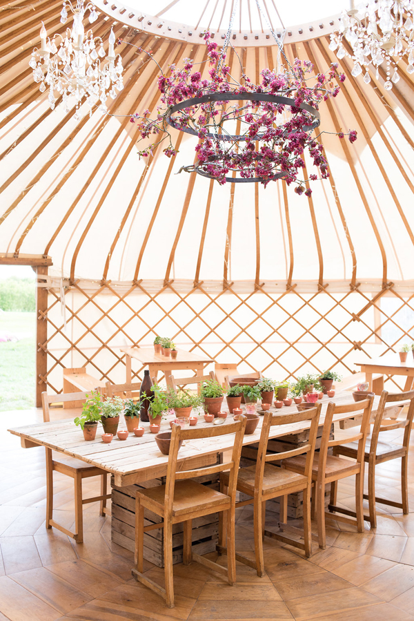 Cherry blossom chandelier and rustic wedding table // Photography Captured by Katrina // The Honeysuckle Flower Co. // Wedding Yurts // The Natural Wedding Company