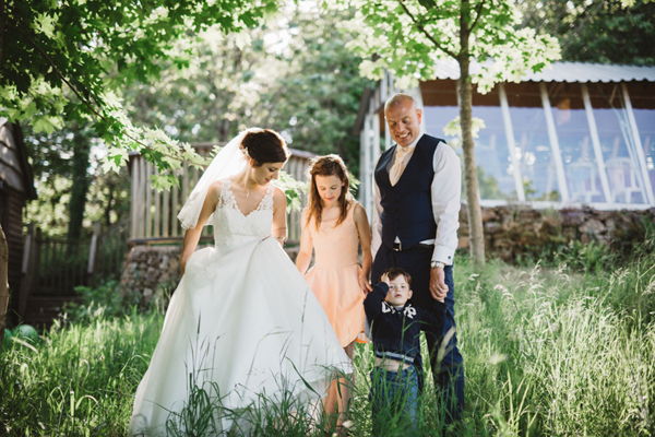 Family picture on wedding day with beams of light // Enchanted Brides // The Natural Wedding Company