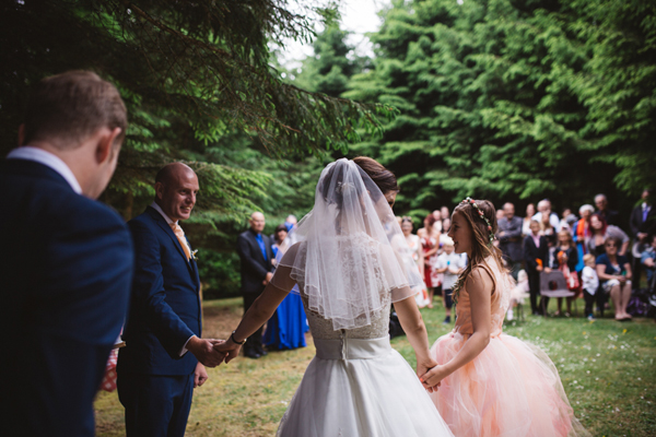 Bride, groom and daughter at outdoor woodland wedding // Enchanted Brides // The Natural Wedding Company