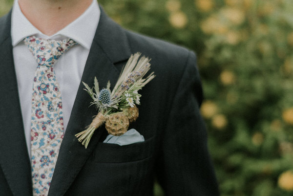 Buttonhole with thistle and lavender // Scuffins Photography // The Natural Wedding Company