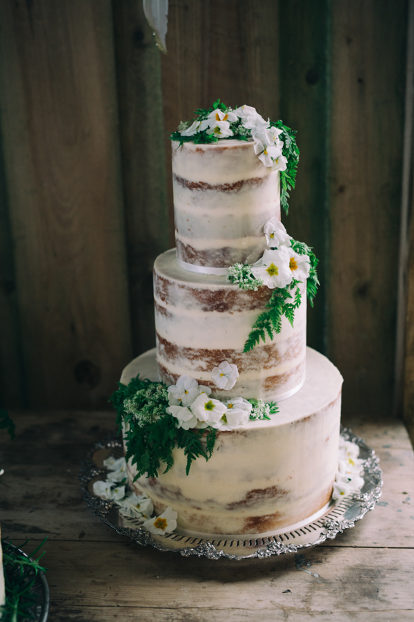 Naked wedding cake with edible flowers and herbs // Enchanted Brides Photography // The Natural Wedding Company