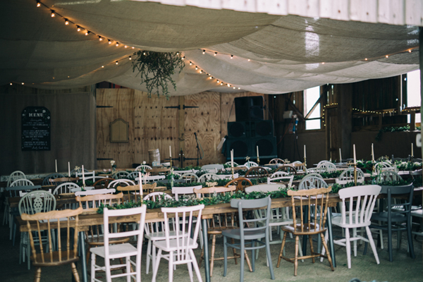 Rustic industrial barn wedding decor with vintage chairs // Enchanted Brides Photography // The Natural Wedding Company