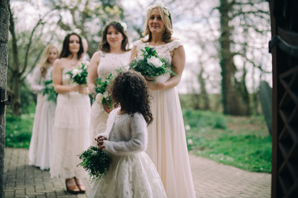 Bridesmaids all in white with green and white bouquets // Enchanted Brides Photography // The Natural Wedding Company