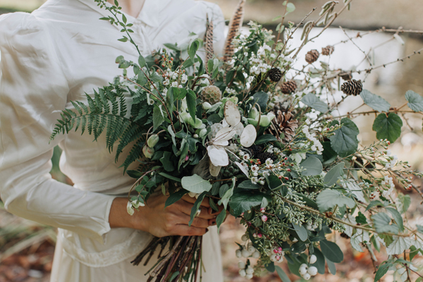 Wild winter bouquet with seedheads, feathers, ferns and pine cones // Megan Duffield Photography // The Natural Wedding Company