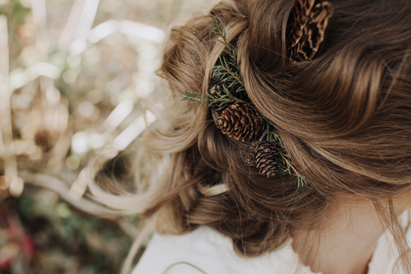 Winter wedding hair with feathers and pine cones // Megan Duffield Photography // The Natural Wedding Company
