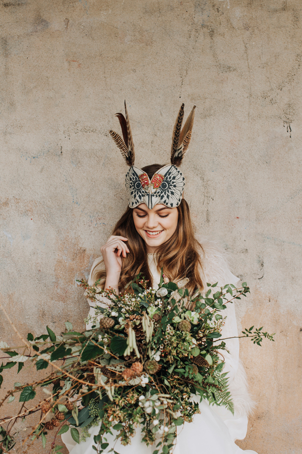 An earthy woodland wedding shoot with exquisite animal masks and a seasonal winter bouquet of seedheads and ferns // Megan Duffield Photography // The Natural Wedding Company