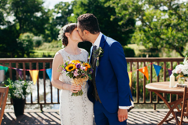 Bride and groom kiss // Bohemian Weddings // The Natural Wedding Company