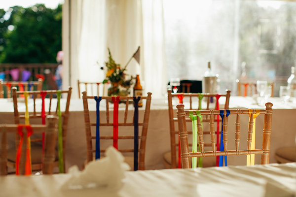 Colourful ribbon decorated chairs // Bohemian Weddings // The Natural Wedding Company
