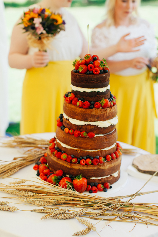 Naked chocolate wedding cake with berries // Bohemian Weddings // The Natural Wedding Company