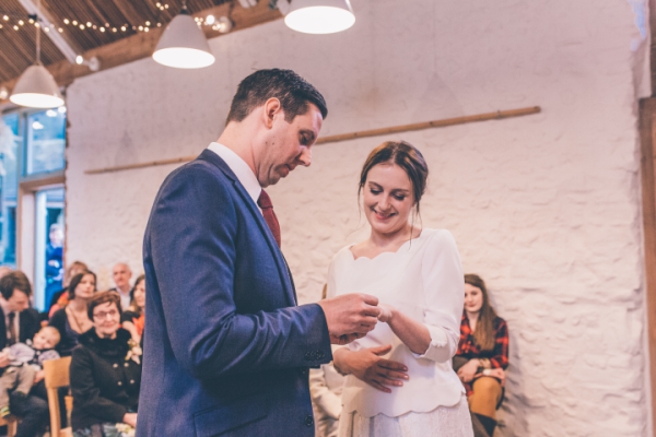 Exchanging wedding rings // Cosy winter wedding at River Cottage // Larissa Joice Photography // The Natural Wedding Company
