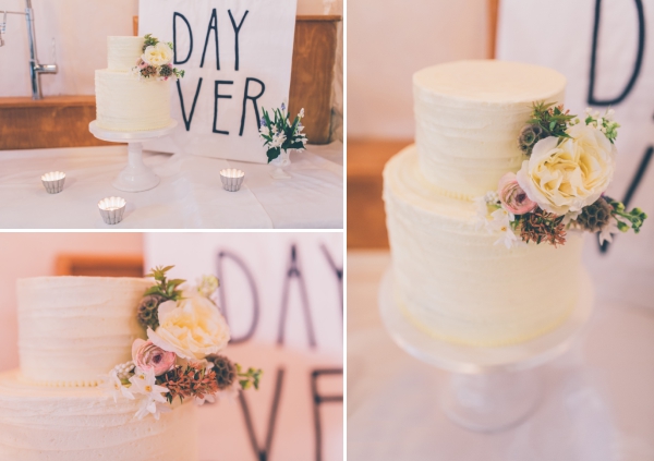 Two tier wedding cake with buttercream and flowers // Cosy winter wedding at River Cottage // Larissa Joice Photography // The Natural Wedding Company