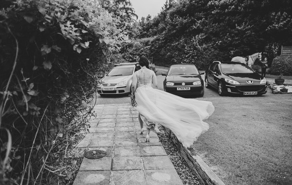 Brides dress in the wind at a garden tipi wedding // Tracey Warbey Photography // The Natural Wedding Company