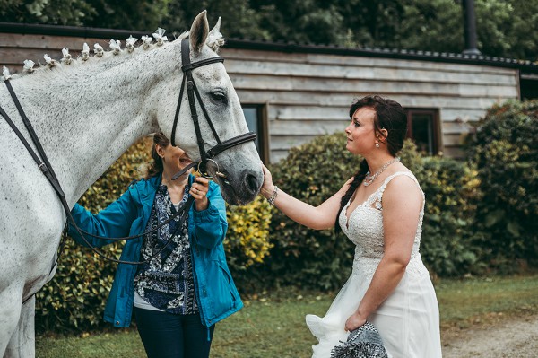 Bride and a grey horse at a garden tipi wedding // Tracey Warbey Photography // The Natural Wedding Company